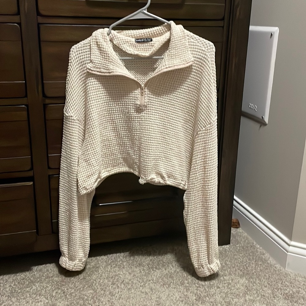 Small, cropped zip up